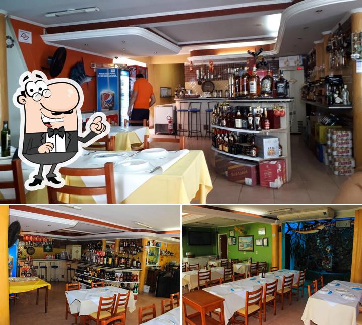 Sente em uma das mesas no Restaurante Astúrias