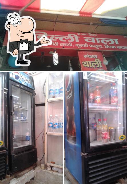 Take a look at the image showing interior and food at Delhi Wala