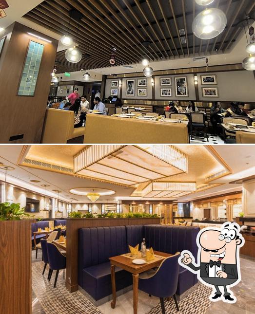 Take a seat at one of the tables at Punjab Grill Pacific Mall Of Faridabad, NIT