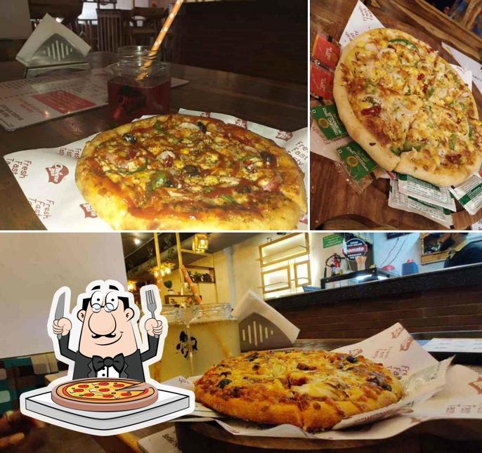 Get pizza at Cheeze Box