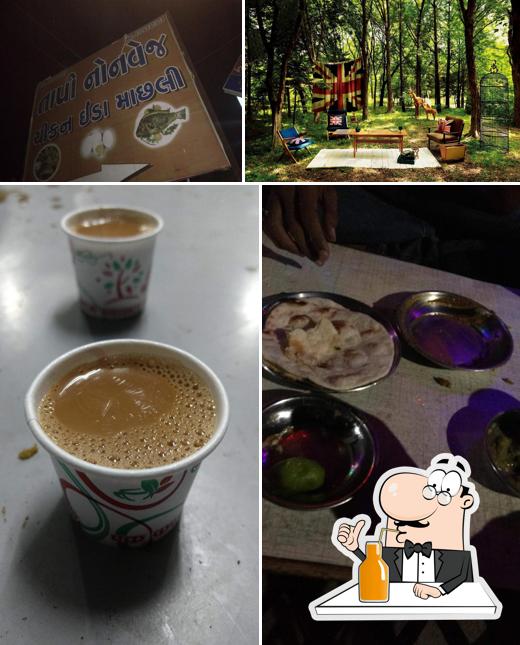 Enjoy a beverage at Tapi Non-Veg Hotel