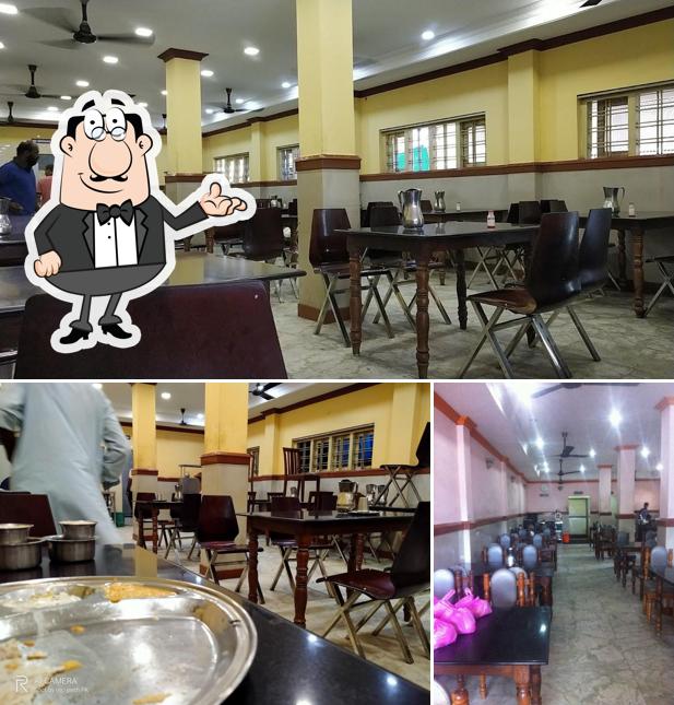 Take a seat at one of the tables at Hotel Abhirami