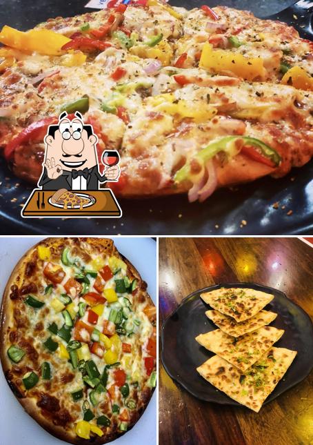 Order pizza at THE BEAST CAFE & FAREBI CHAAT