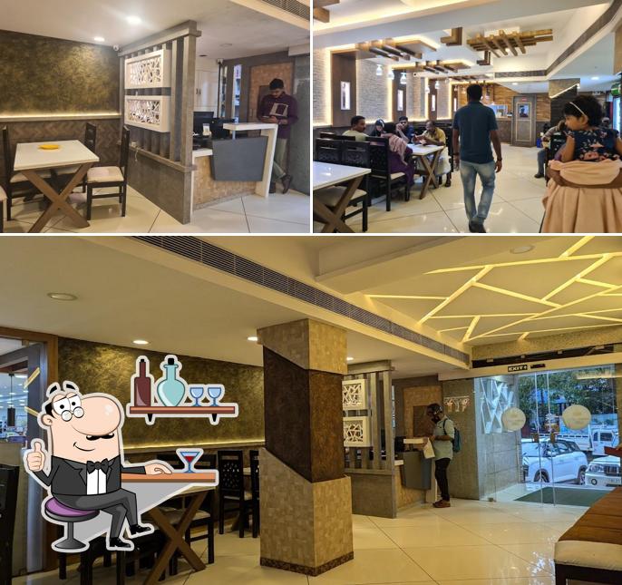 Take a seat at one of the tables at RFC Arabian Cafe Attingal