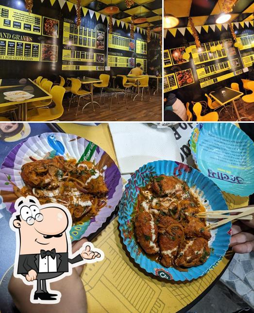 Take a seat at one of the tables at Momo Addiction, BEST CHINESE RESTAURANT ,Subhash Nagar