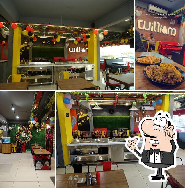 Take a seat at one of the tables at William John's Pizza Himatnagar