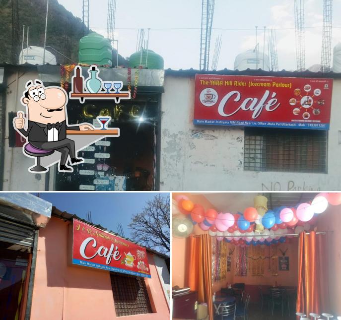 Take a seat at one of the tables at THE-YARA (Y&R) Cafe (icecream parlour) First Cafe In Uttarkashi