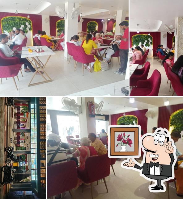 Take a seat at one of the tables at Vrindavan City Restaurant (Best Restaurant In Vrindavan)