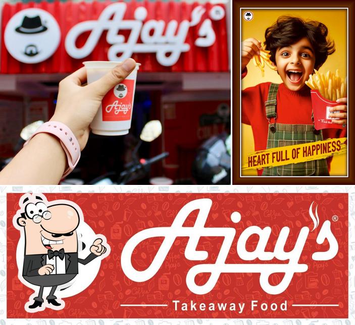 Take a seat at one of the tables at Ajay's Cafe