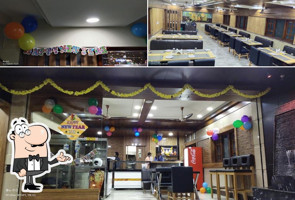 Take a seat at one of the tables at Sea Spice Multi Cusine Family Restaurant