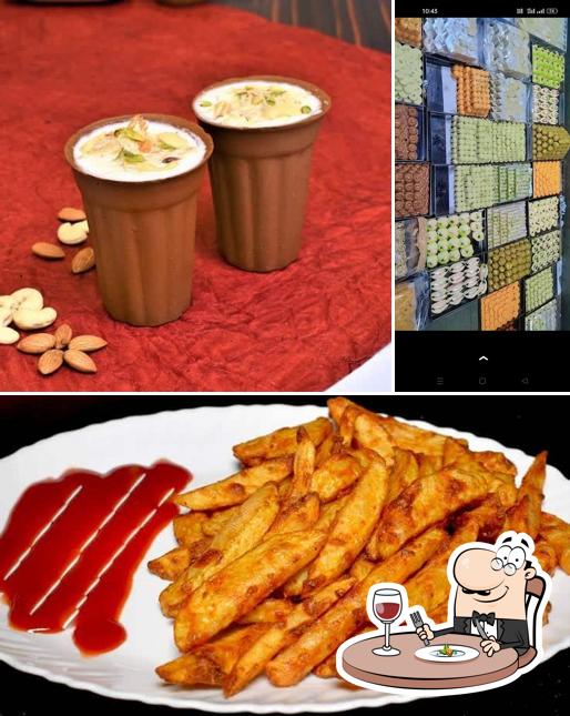 Among various things one can find food and interior at JFC Sweets & Restaurant