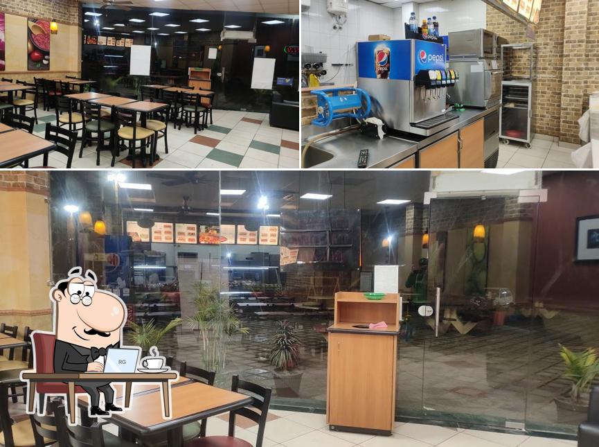 Take a seat at one of the tables at Subway Faridkot