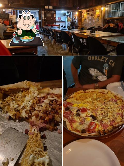 A imagem a Pizza Nostra’s comida e interior