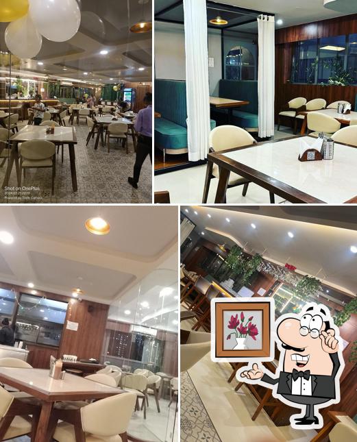 Take a seat at one of the tables at New taste & flavour veg & non veg