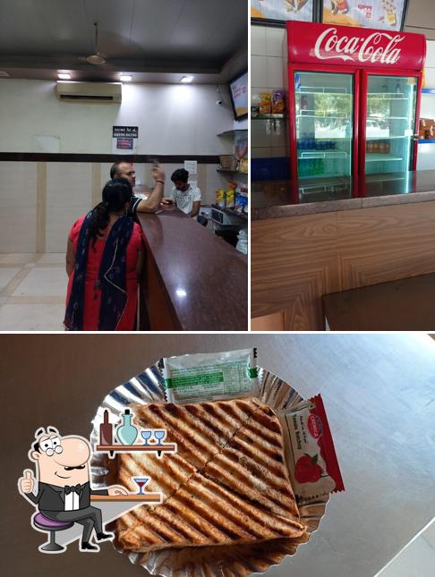 Check out the image displaying interior and food at Balaji Sandwich