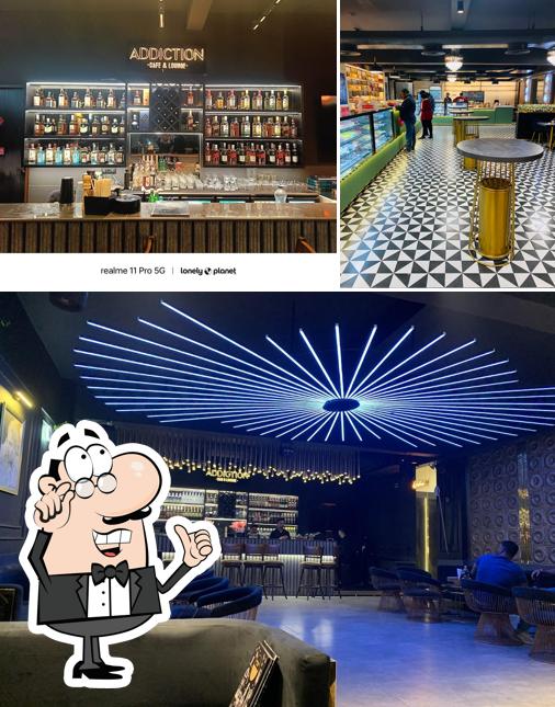 Take a look at the photo displaying interior and beverage at Temptation Restaurant & Addiction Bar