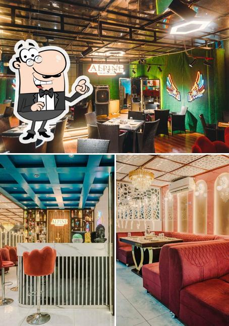 Take a seat at one of the tables at Alpine Restaurant & Rooftop