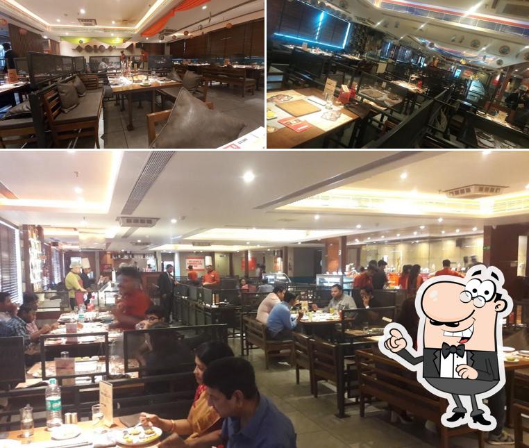 Take a seat at one of the tables at Barbeque Nation