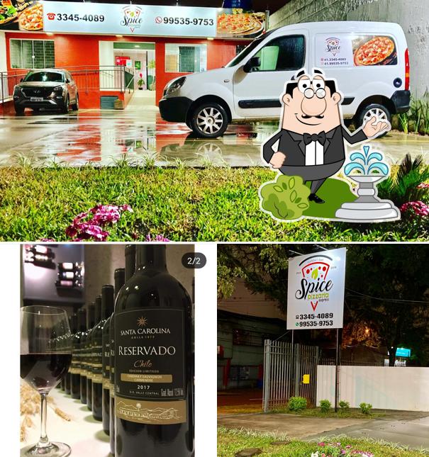 Entre diversos coisas, exterior e vinho podem ser encontrados no Spice Pizzaria Portão