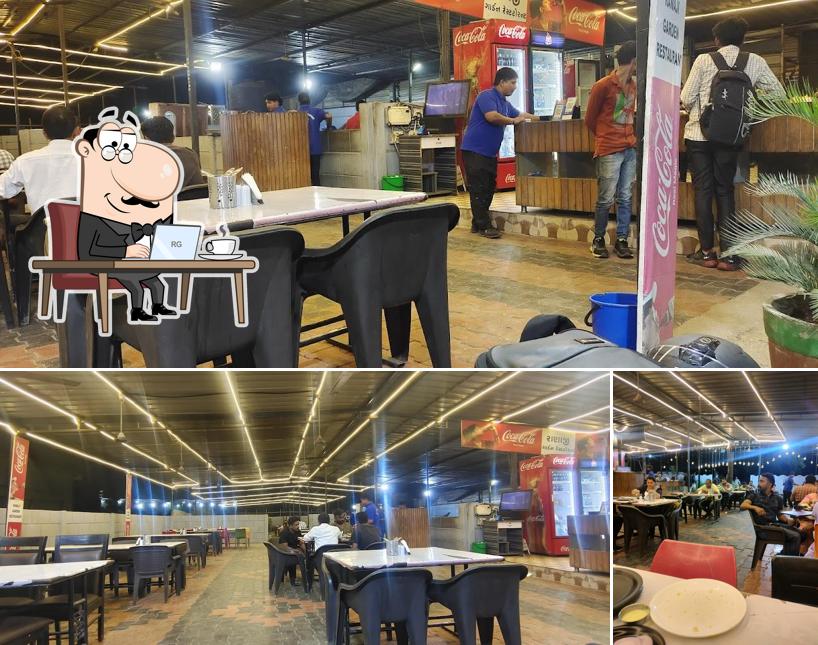 Take a seat at one of the tables at Ranaji Garden Restaurant