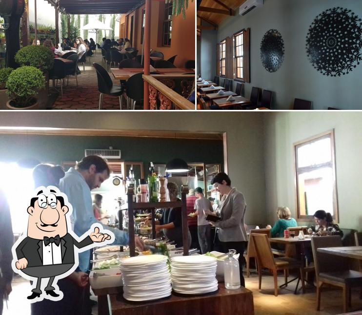 Sente em uma das mesas no Santa Rita Restaurante