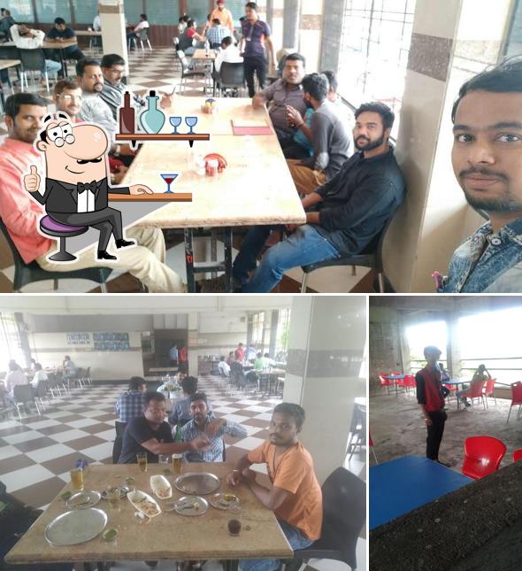 Take a seat at one of the tables at Abhi Bar & Restaurant