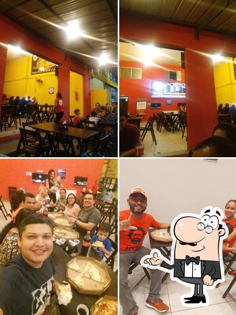 Sente em uma das mesas no Sr. Forneria Pizzas Marambaia