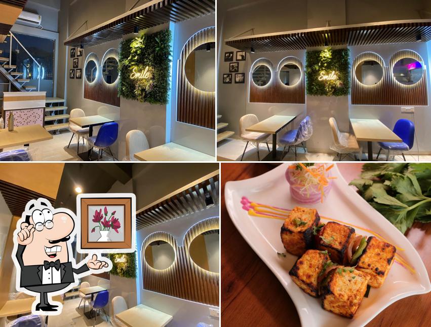 Take a seat at one of the tables at Moti Mahal Tandoori Trail Gurugram Sector 86 - SS Omnia