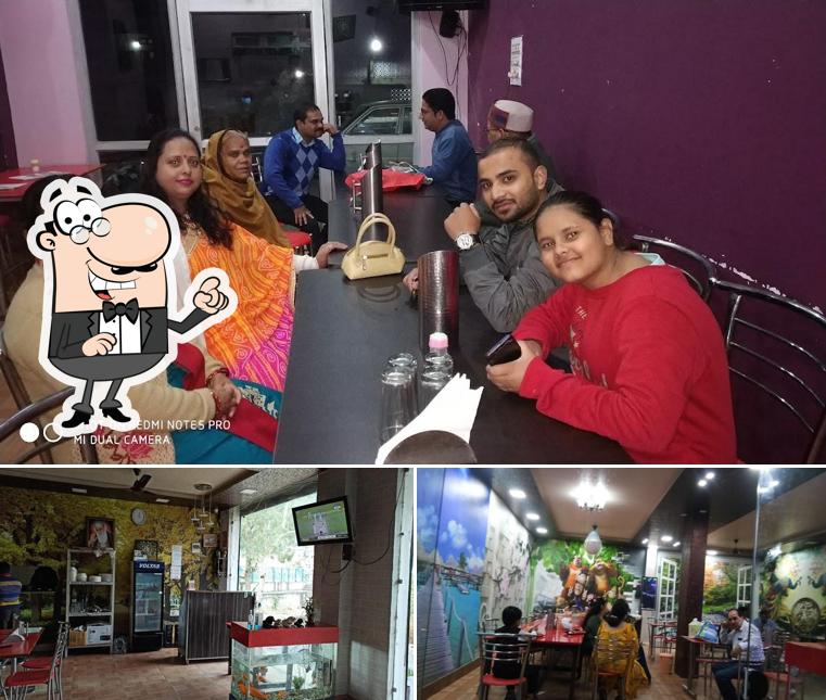 Take a seat at one of the tables at SAMRAT FAMILY Restaurant