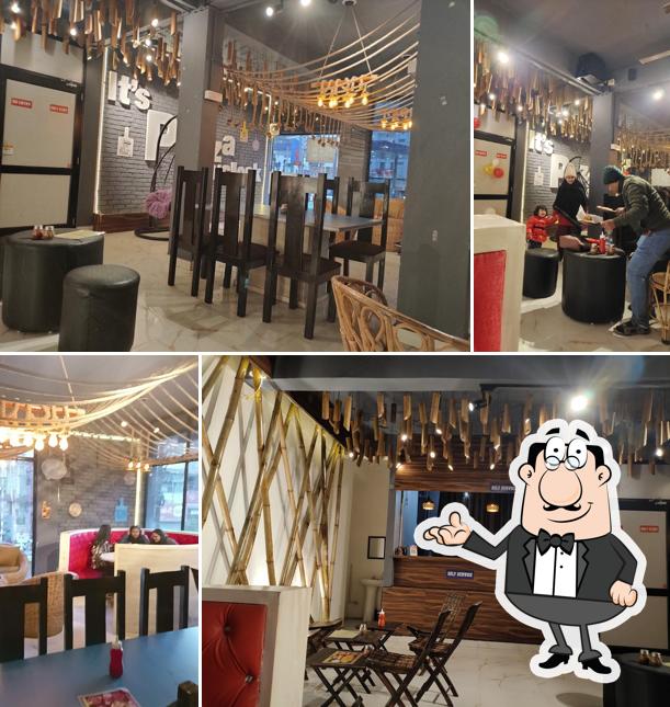 Take a seat at one of the tables at Be Pizzerian