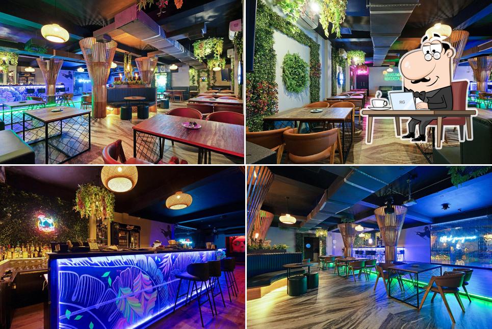 Take a seat at one of the tables at Wild Monkey Nightlife