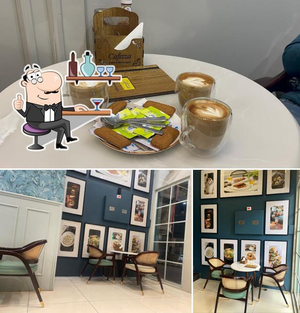 Take a seat at one of the tables at Cafizza The Best & Premium Cafe In Sirsa