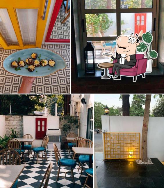 Take a seat at one of the tables at Roastery Cultúr - The Coffee Company