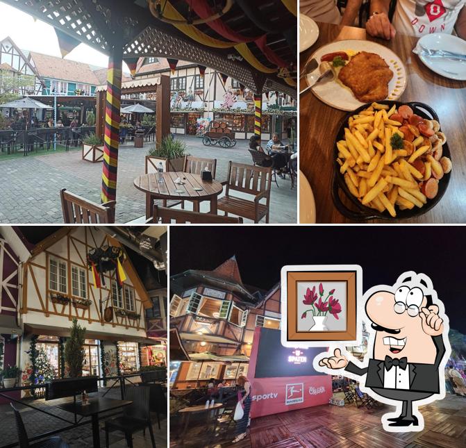 Sente em uma das mesas no Restaurante Vila Germânica