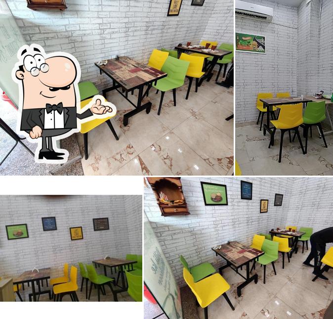Take a seat at one of the tables at Radha Krishna Chole Bhature