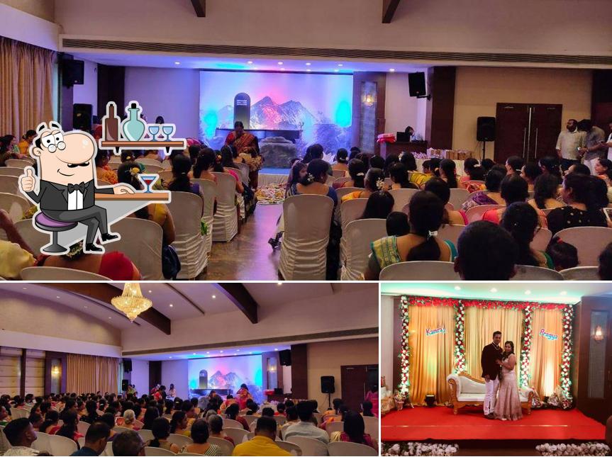 Take a seat at one of the tables at Chaska Multicuisine Restaurant