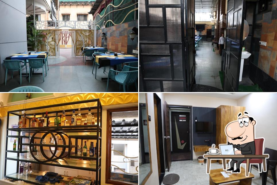 Take a seat at one of the tables at Meghraj Family Restaurant Bar