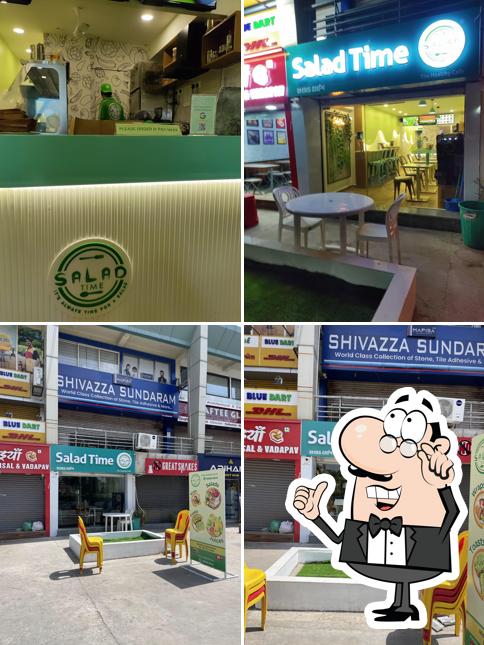 Take a seat at one of the tables at Salad Time - Healthy Food Cafe for Fresh Salads, Wraps and Cold Press Juices (Vegan Options Available)