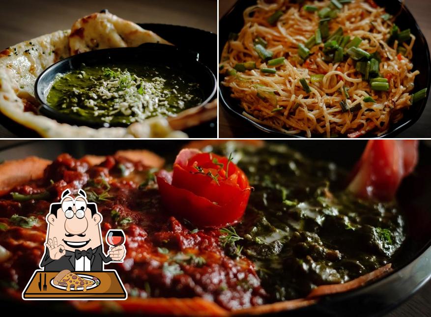 Try out pizza at Dhanraj Kitchen and Bar