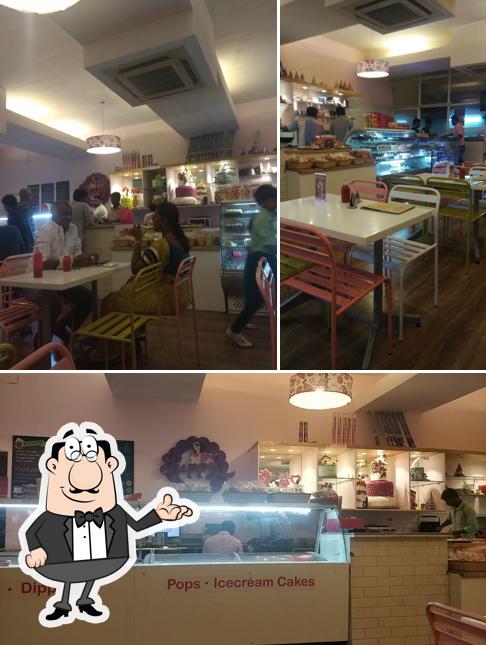 Take a seat at one of the tables at Puppy's Bakery - Exclusive Desserts Continental Cuisine Instagrammable Café in Madurai - Anna Nagar