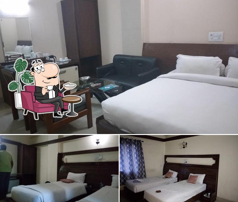 Take a seat at one of the tables at Hotel Radhika Regency