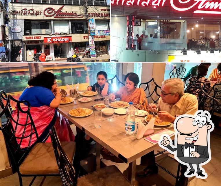 Take a seat at one of the tables at Aminia Restaurant - Barrackpore