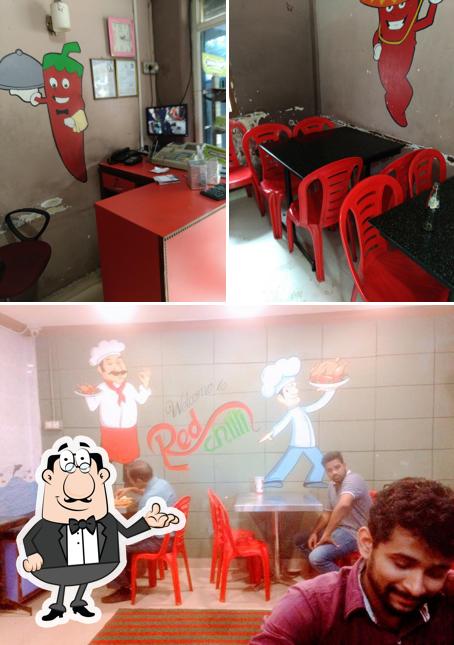 Take a seat at one of the tables at Red Chilli hut Hotel