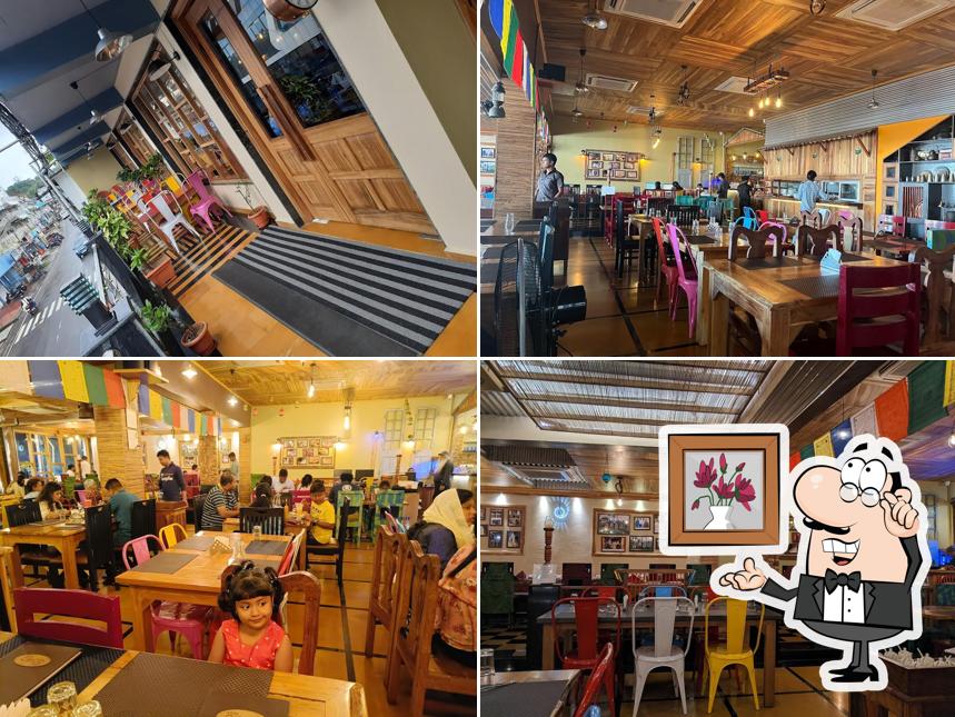 Take a seat at one of the tables at Anju Coco Resto