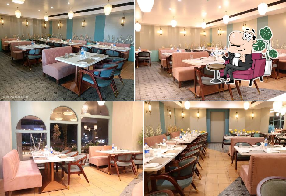 Take a seat at one of the tables at PNS NAKSHATRA - VRINDAVAN - Veg Fine Dining in Vellore