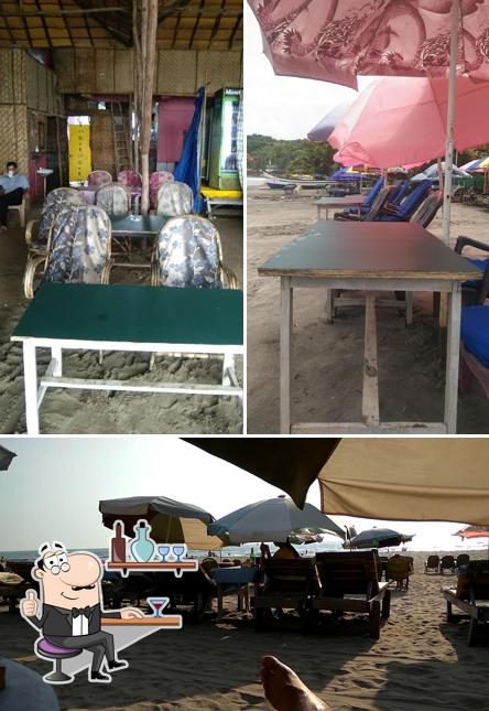 Take a seat at one of the tables at Mango Tree Bar & Restaurant