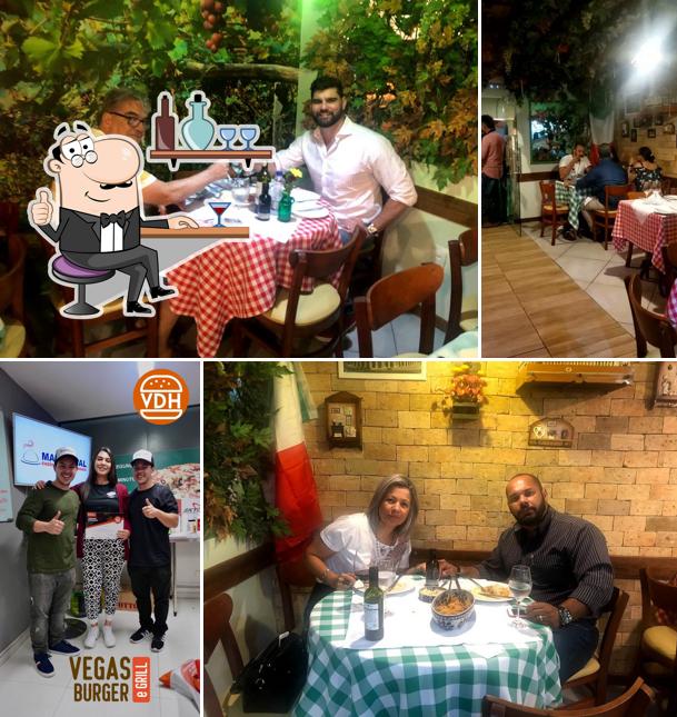 Sente em uma das mesas no Cantina Buoni AmiciVilas