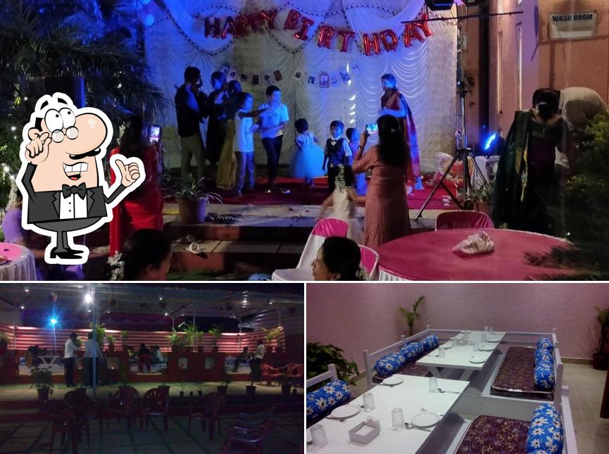 Take a seat at one of the tables at Rajwada Restaurant