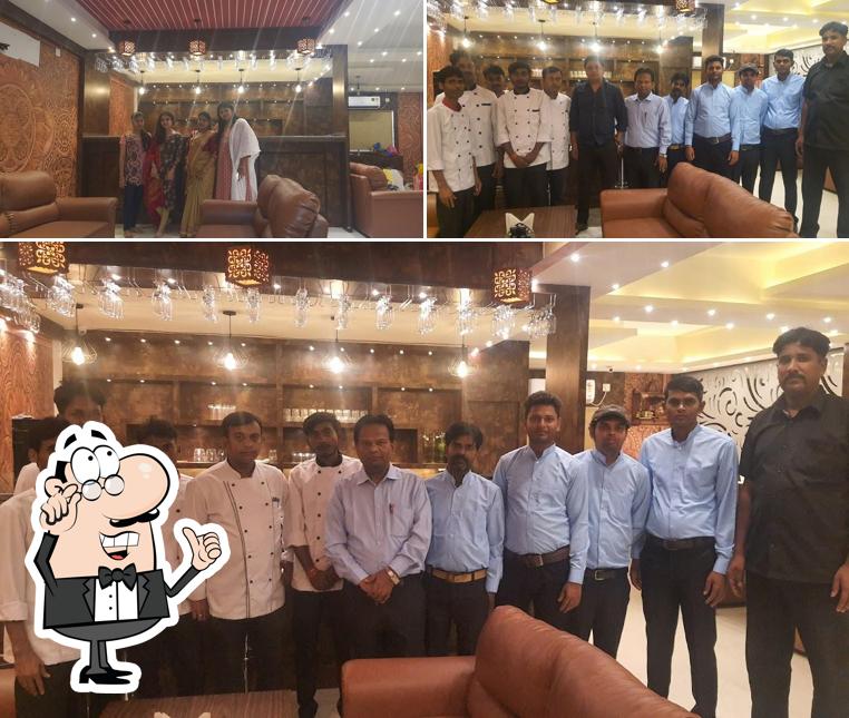 Take a seat at one of the tables at Carnival Lounge Bar & Restaurant