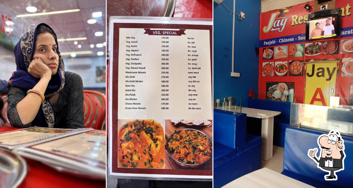 Take a seat at one of the tables at Jay somnath restaurant